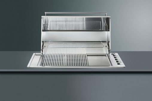 Also available in a flat lidded version, the Smeg Classic Hooded barbecue (BIBQ1205AH, RRP $3,690) has five stainless steel burners, integrated fat and oil collection system, Teppanyaki plate and warming rack. 