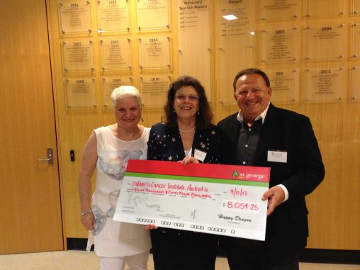 Donation: Kitty Hammerman, CCIA executive director Michelle Haber and Peter Hammerman.