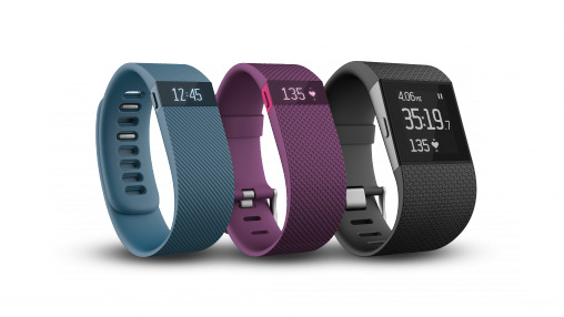 Fitbit Charge in blue and burgundy and the Surge.