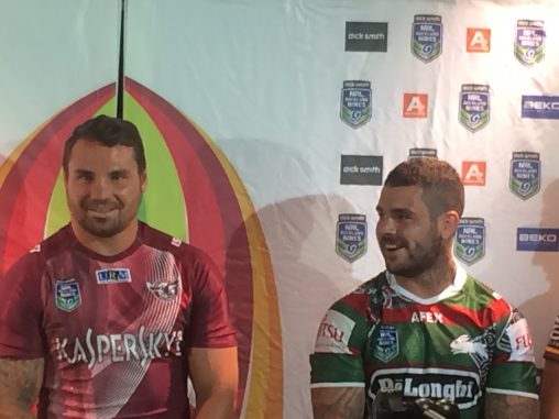 Manly's Anthony Watmough showcases Kaspersky while sharing a joke with Adam Reynolds from the De'Longhi and Fujitsu General Rabbitos.