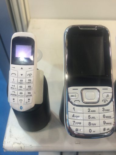 A close up look at the most featury of feature phones, with a traditional dumbphone next to it for scale.