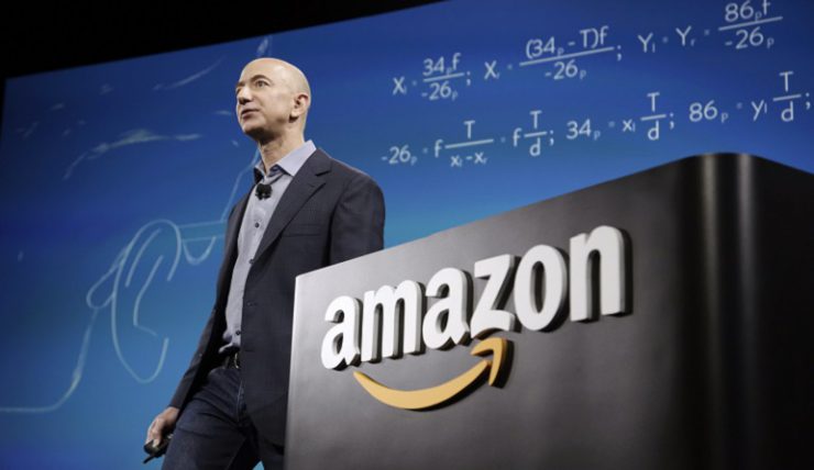 Amazon CEO Jeff Bezos discusses his company's new Fire smartphone at a news conference in Seattle, Washington June 18, 2014. Bezos unveiled a $200 "Fire" smartphone on Wednesday equipped with a 3D-capable screen and an ability to recognize music and TV shows, hoping to stand out in a crowded field dominated by Apple Inc and Samsung Electronics. REUTERS/Jason Redmond (UNITED STATES - Tags: SCIENCE TECHNOLOGY BUSINESS TELECOMS) - RTR3UIDN