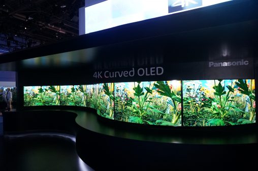The wave-shaped wall of Curved OLED TVs outside Panasonic’s stand.