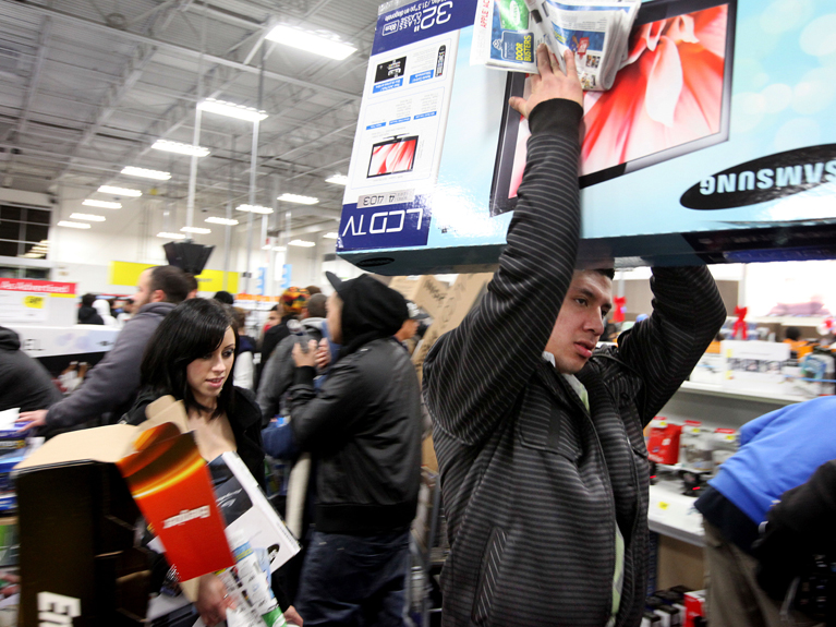 SAN DIEGO, CA - NOVEMBER 25:  Customers shop for electronics items during 'Black Friday' at a Best Buy store on November 25, 2011 San Diego, California. Thousands of consumers are queuing at various stores across the nation to take advantage of 'Black Friday' deals as the holiday shopping season begins in America.  (Photo by Sandy Huffaker/Getty Images)
