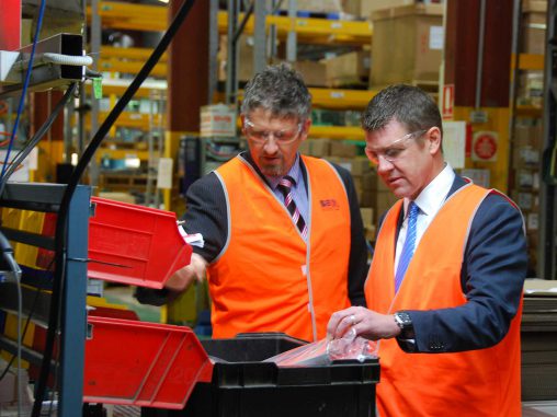 Seeley International Director, Jon Seeley and NSW Premier, the Hon. Mike Baird, inspecting materials used in the manufacturing process.